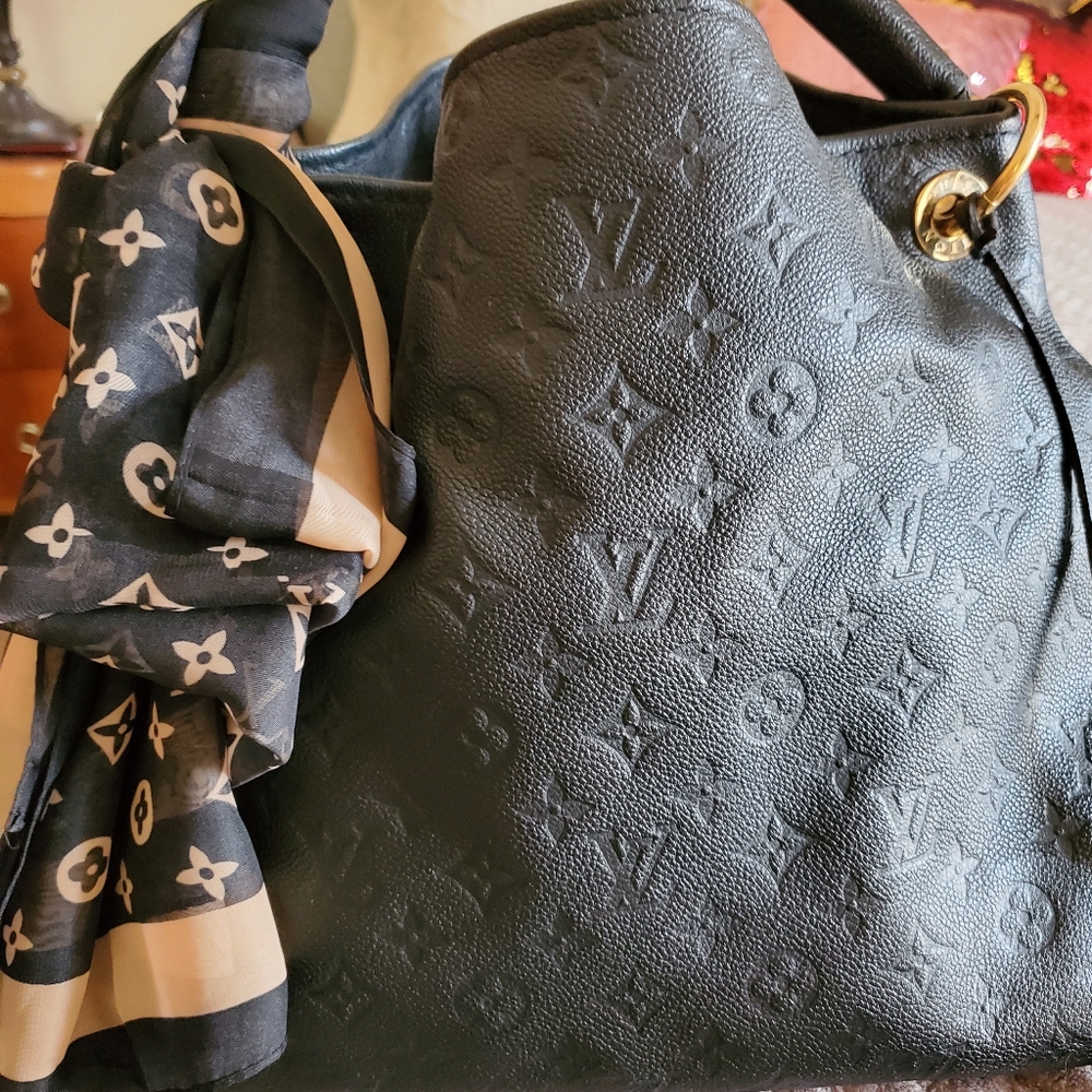 Louis Vuitton Elegant Black Embossed Leather Hobo Bag